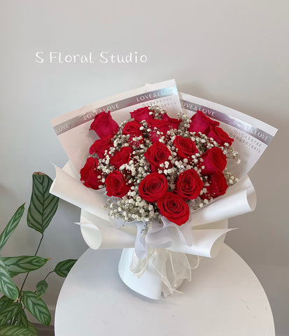 Red roses with baby’s breath bouquet
