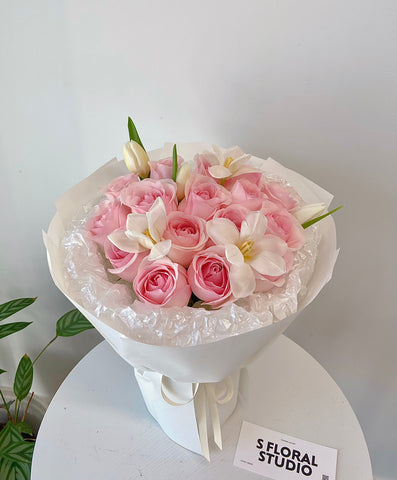 Pink roses with white tulips bouquet