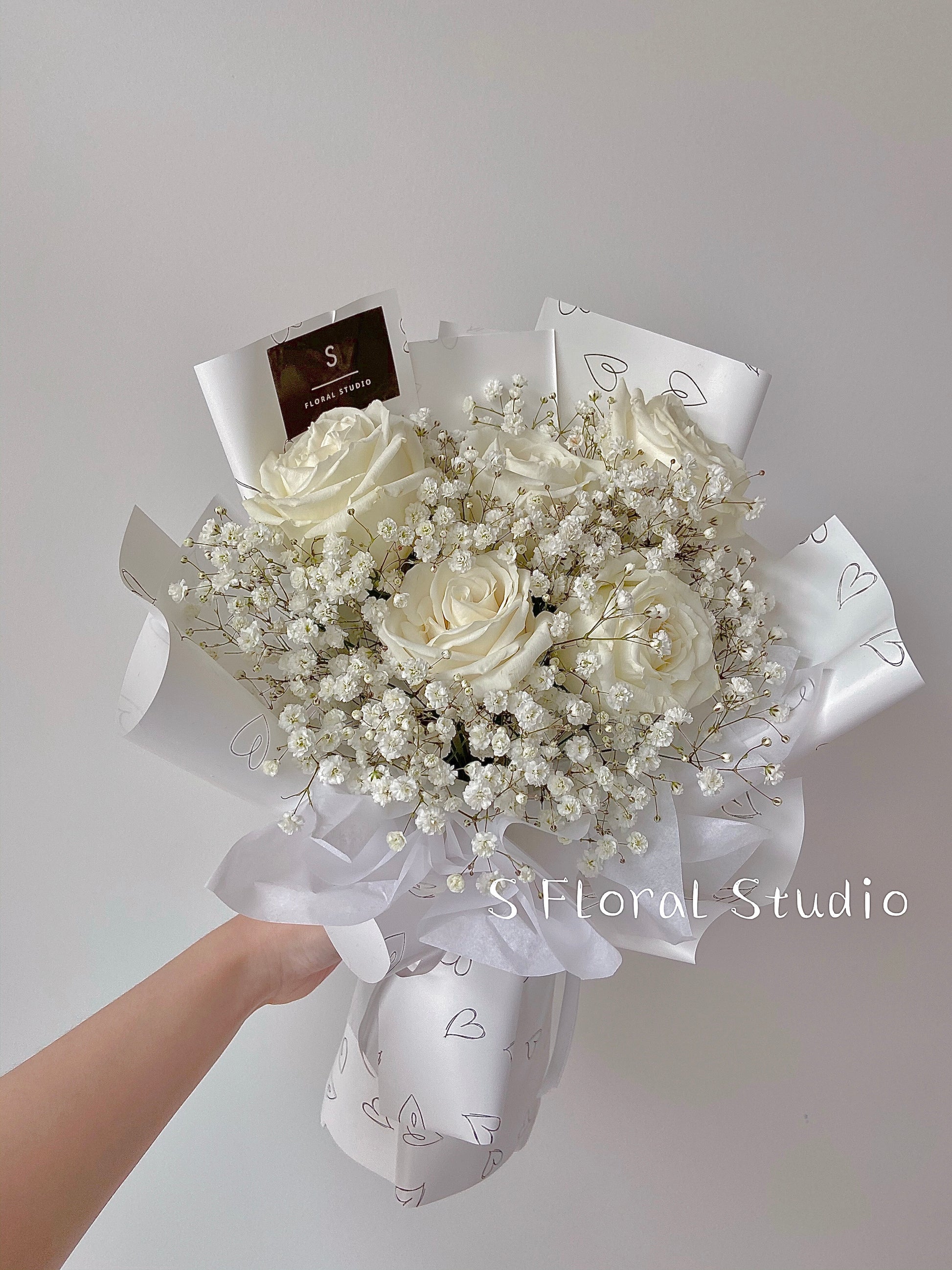 White rose with gypsophila bouquet