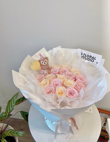 Preserved roses Bouquet with Disney Doll