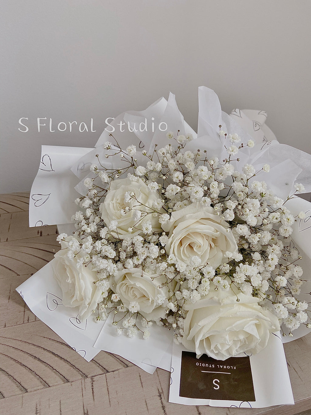 White rose with gypsophila bouquet