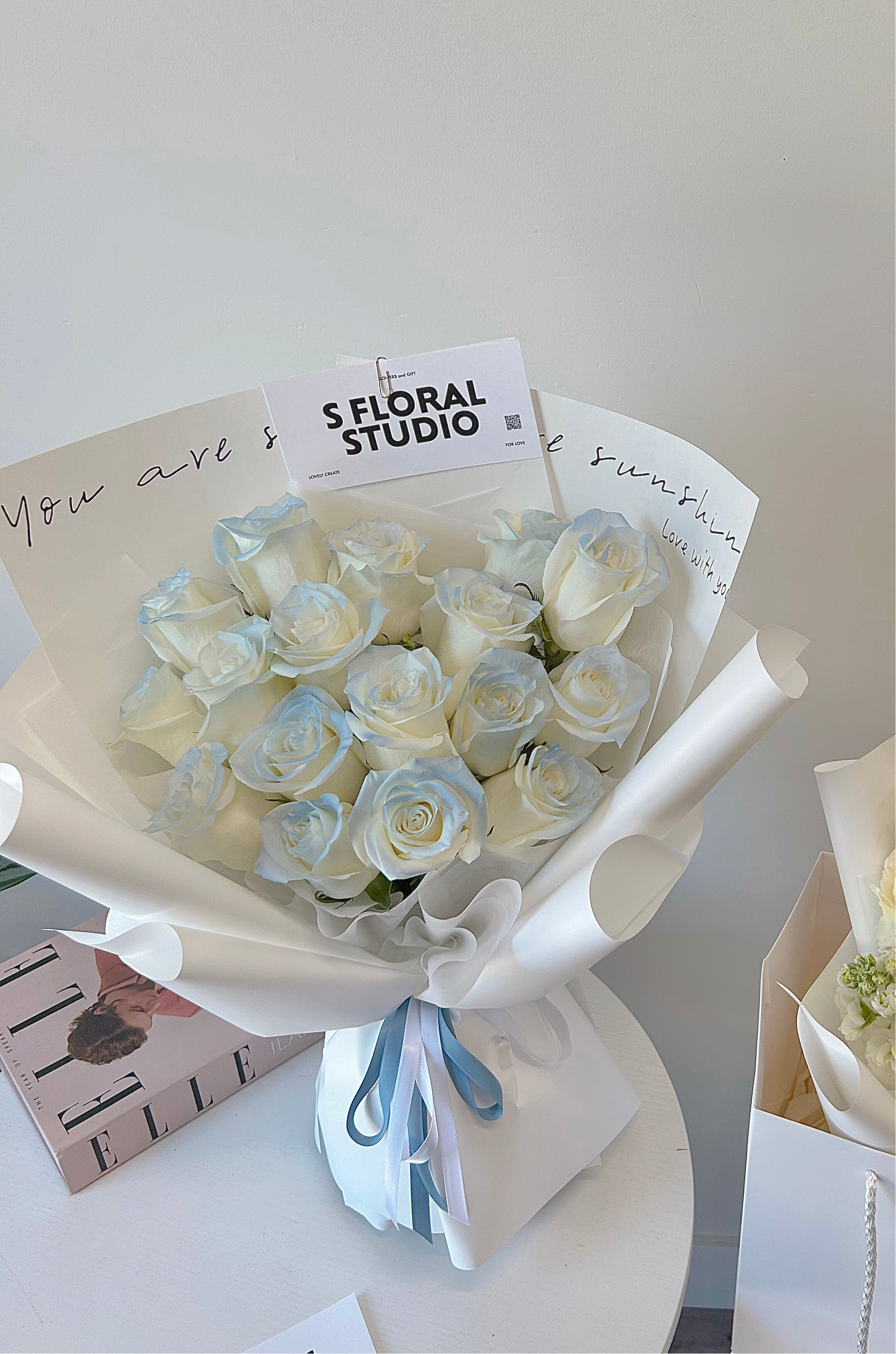 Tinted light blue roses bouquet 16